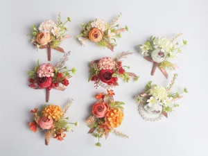 Artificial wedding boutonnieres and wrist flower sets, elegant floral suit accessories for men and women.