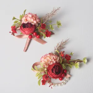 Elegant wedding floral boutonniere and pearl wrist corsage set for groom and bridal party.