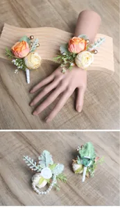 Artificial rose flower wrist corsage and boutonniere set for wedding party dress.