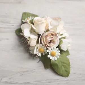 Exquisite handmade vintage floral hair comb with roses and daisies for wedding parties.