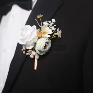 Elegant white and green artificial rose boutonniere for wedding suit, groom corsage and prom flower decor.
