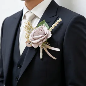 Exquisite simulation rose boutonniere for wedding suit, elegant floral detail and ribbon design.