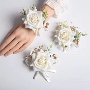 White artificial rose wrist flower and corsage set for western weddings and party events.