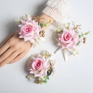 Artificial pink rose wrist flower corsage set for wedding party guest celebration decor.