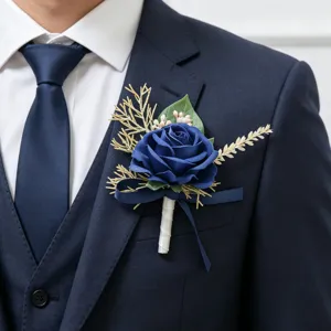 Detailed view of the dark blue artificial rose boutonniere with gold leaves for men suit.