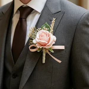 Pink artificial rose boutonniere for wedding suit groom and groomsmen decoration.