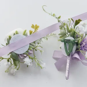 Artificial rose boutonniere detail shot, forest style wedding corsage with purple ribbon.