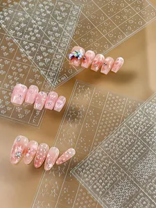 Pegatinas de uñas 3D transparentes con bonitos diseños de lazos corazones y estrellas.