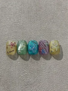 Colorful 3D flower nail art press on nails set with cute English letters decoration.