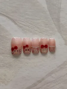 Conjunto de uñas postizas bonitas con lazo rojo, uñas postizas dulces para fiesta y diario.