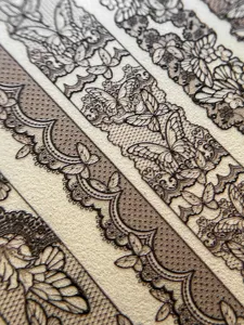 Close-up of 3D embossed lace butterfly nail stickers, showing intricate mesh floral lace patterns.