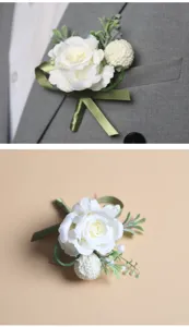 Boutonnière de mariage rose blanche feuilles vertes style forêt détail de la fleur homme.