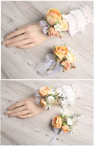Orange artificial flower wrist corsage and boutonniere set for wedding bride and bridesmaid.
