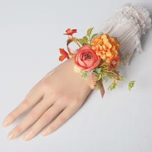 Artificial floral wrist corsage for wedding bridesmaid and party dress accessory decoration.