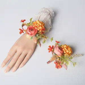 Wedding wrist corsage and groom boutonniere set, elegant European floral accessory detail view.