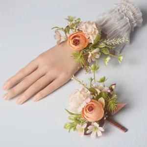 Exquisite artificial flower wrist corsage and matching boutonniere set for wedding details.