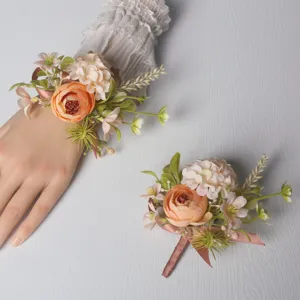Detail shot of the exquisite artificial floral wedding wrist corsage and matching boutonniere.