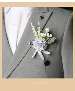 Close-up detail view of elegant grey artificial flower boutonniere pinned on suit lapel.
