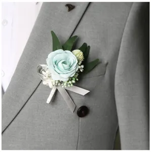 Exquisite blue rose boutonniere detail shot, elegant wedding suit corsage accessory for men.