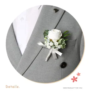 Elegant white rose wedding boutonniere detail shot for groom and event VIP guests.