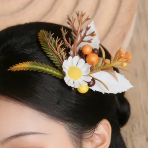 Close-up view of pastoral floral hair clip featuring simulation daisy and berries for elegant updo.