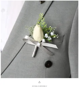 Exquisite white boutonniere with ribbon for wedding groom, business meetings and party events.