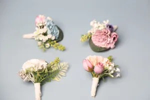 European style wedding boutonniere set for groom, bride and guests, elegant floral decoration.