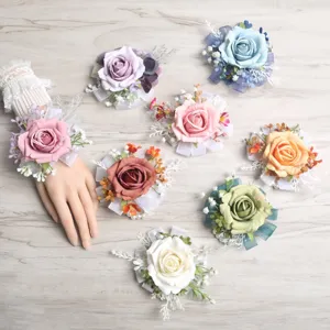 Beautiful artificial rose wrist flowers for weddings, parties, and bridesmaid corsages.