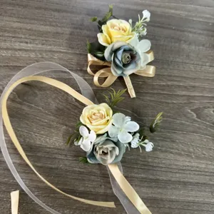 Artificial rose wrist corsage and boutonniere set for outdoor wedding parties and bridesmaids.