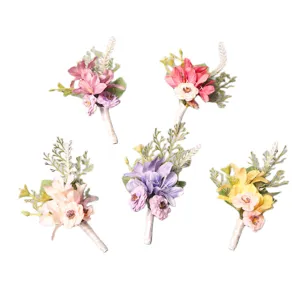 Set of 5 colorful artificial wedding boutonnieres for groom and groomsmen decoration.