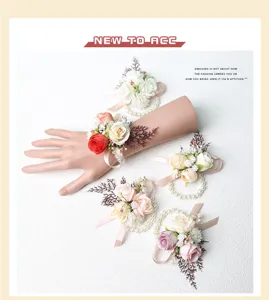 Artificial flower wrist corsage detail, wedding pearl bracelet flower accessory.
