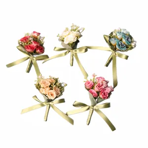 Set of 5 colorful artificial rose boutonnieres with green ribbons for weddings and parties.