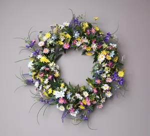Colorful artificial wildflower daisy wreath for spring home wall decor and door hanging.