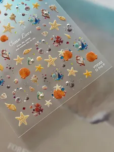 3D embossed ocean nail stickers featuring starfish, shells and conches for summer nail art designs.
