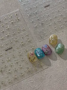 3D metallic flower nail art stickers, embossed gold and silver floral decals for DIY manicure design.
