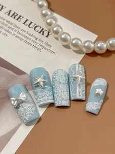 Blue press-on nails with white lace relief pearls and bows, elegant fake nail art set.