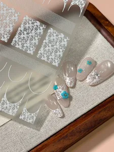 Vintage french white lace nail art stickers detail, elegant floral DIY nail decoration sheet.