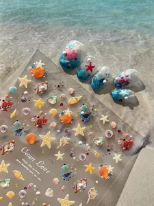 Ocean series 3D embossed nail art stickers, close-up details with starfish and seashells.