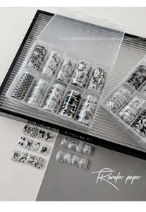 Detailed view of the 10-grid nail transfer paper set with monochrome black and white patterns.
