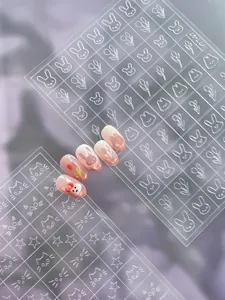 Embossed 3D cartoon nail stickers detail featuring cute rabbit and tulip patterns for DIY manicure.