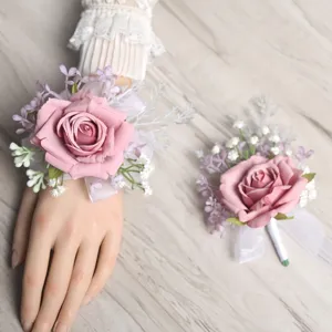 Elegant artificial rose wrist flower and matching corsage set for wedding party decor.