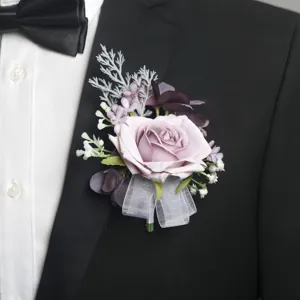 Elegant artificial rose boutonnière for wedding party groom and guest suit decoration.