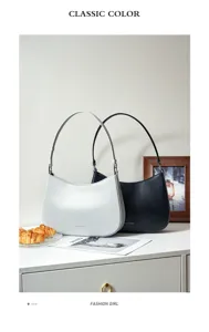 Detailed view of women's underarm shoulder bag in white and black, premium leather style.