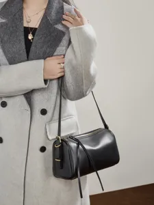 Genuine leather cylindrical shoulder bag for women, stylish crossbody pillow bag, solid color.