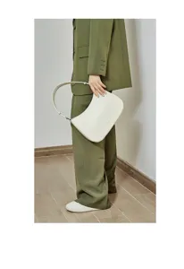 Detailed view of a stylish white leather underarm bag, elegant minimalist design for daily wear.