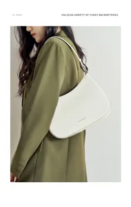 Elegant white leather hobo shoulder bag for women, chic baguette handbag for daily fashion.