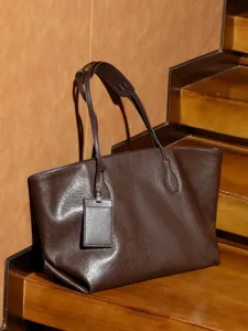 Premium genuine leather dark brown tote bag for women, large capacity stylish commute shoulder bag.