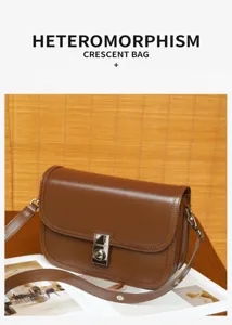 Vintage brown leather shoulder bag detail, stylish crescent crossbody bag with metal lock.