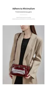 Close-up detail view of the elegant red patent leather shoulder bag styled with blazer.