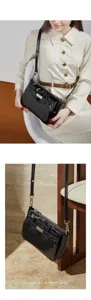 Glossy black leather shoulder bag with chic metal lock and stylish strap details for daily wear.